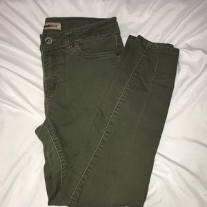 A pair of army colored skinny jeans